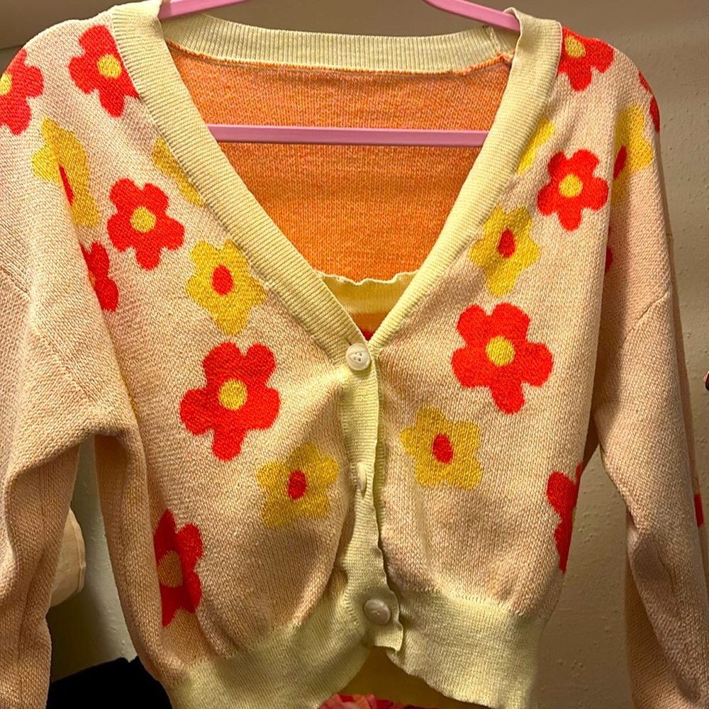 A two piece cardigan with undershirt. It’s XL for SHEIN. With flower print.